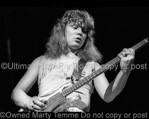 Photo of bassist Steve Priest of The Sweet onstage in 1976 by Marty Temme