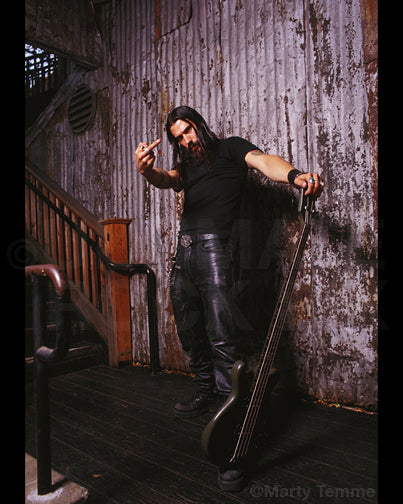 Photos of bass player Johny Chow of Systematic during a photo shoot in 2003 by Marty Temme