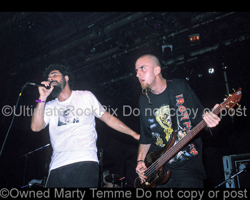 Photo of Serj Tankian and Shavo Odadjian of System of a Down in concert in 1998 by Marty Temme