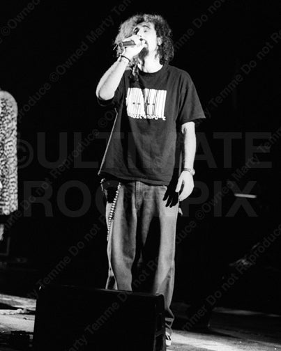 Black and white photo of Serj Tankian of System of a Down in concert by Marty Temme