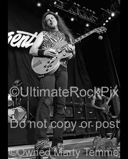 Black and white photo of guitarist Ted Nugent in concert by Marty Temme