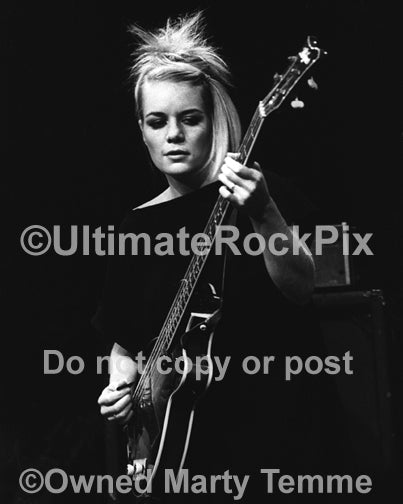 Black and white photo of bass player Tina Weymouth of Talking Heads playing a Hofner bass in concert in 1979 by Marty Temme