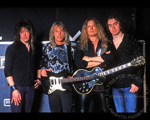 Photo of Randy Gregg, Scott Gorham, John Sykes and Michael Lee of Thin Lizzy during a photo shoot in 2004 by Marty Temme