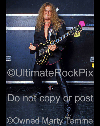 Photo of guitarist John Sykes of Thin Lizzy during a photo shoot in 2004 by Marty Temme