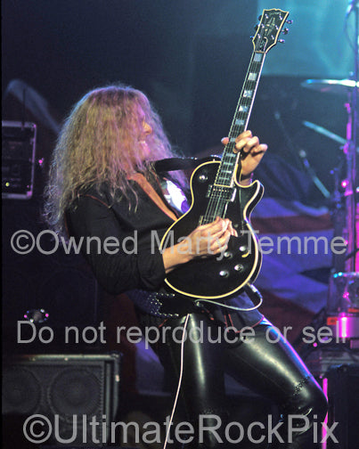 Photo of John Sykes of Thin Lizzy in concert in 2004 by Marty Temme