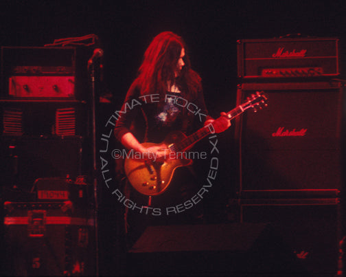 Photo of guitarist Gary Moore of Thin Lizzy in concert in 1977 by Marty Temme