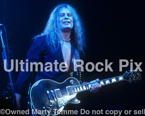 Photo of John Sykes of Thin Lizzy performing in concert in 2004 by Marty Temme