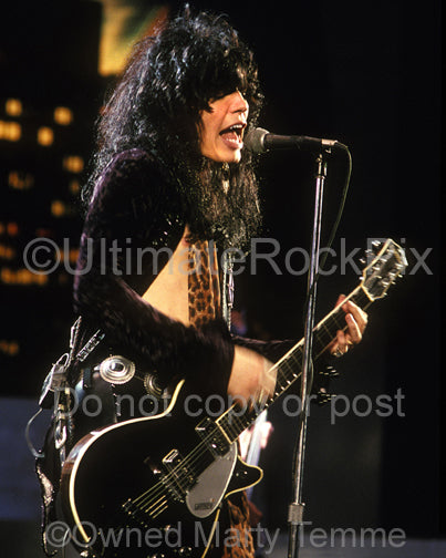 Photo of Tom Keifer of Cinderella playing a Gretsch guitar in 1990 by Marty Temme