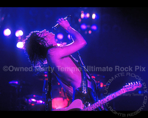 Photo of Tom Keifer of Cinderella playing a Telecaster in 1989 by Marty Temme