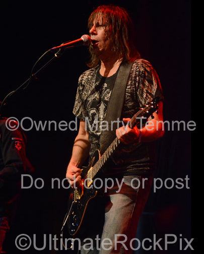 Photo of guitarist Pat Travers in concert in 2012 by Marty Temme