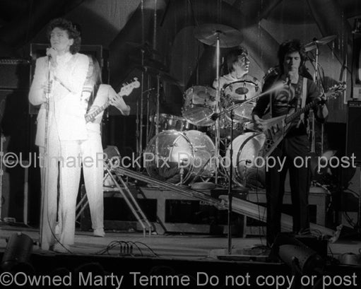 Photo of Fee Waybill, Bill Spooner and Prairie Prince of The Tubes in concert in 1975 by Marty Temme