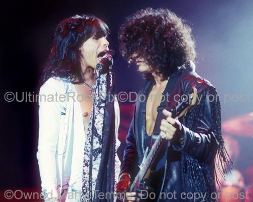 Photos of Steven Tyler and Joe Perry of Aerosmith in concert in 1990 by Marty Temme
