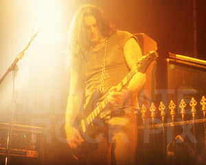 Photo of Peter Steele of Type O Negative playing bass guitar in concert by Marty Temme