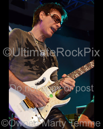 Photo of guitar player Steve Vai onstage in 2012 by Marty Temme