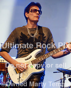 Photo of guitarist Steve Vai in concert in 2012 by Marty Temme
