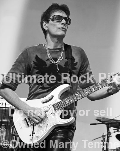 Black and white photo of guitarist Steve Vai in concert in 2012 by Marty Temme