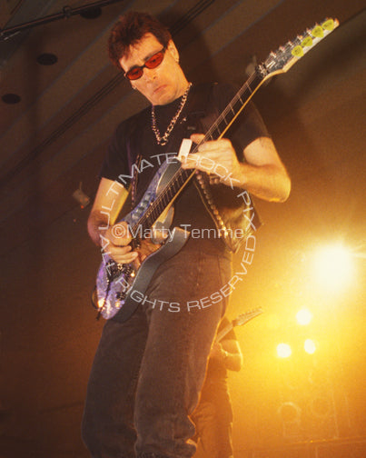 Photo of guitarist Steve Vai in concert in 1998 by Marty Temme