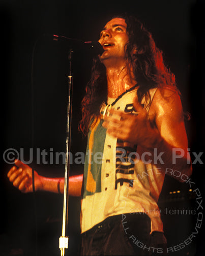 Photo of singer Eddie Vedder of Pearl Jam performing onstage in 1991 in Hollywood, California by Marty Temme