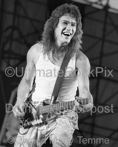 Black and White Photos of Guitar Player Eddie Van Halen Playing a Steinberger Guitar in Concert in 1986 by Marty Temme