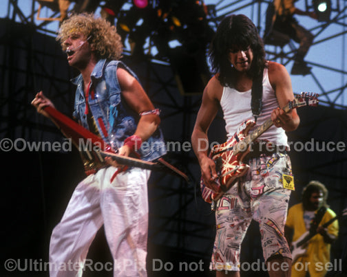 Photo of Eddie Van Halen and Sammy Hagar performing in concert in 1986 by Marty Temme