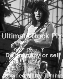 Black and White Photos of Guitar Player Eddie Van Halen Playing a Kramer Guitar in Concert in 1986 by Marty Temme