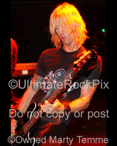 Photo of Duff McKagan of Velvet Revolver and Guns N' Roses in concert in 2006 by Marty Temme