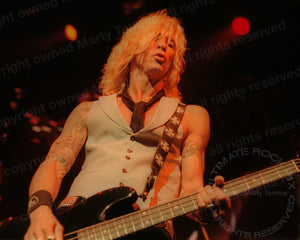 Photo of Duff McKagan of Velvet Revolver and Guns N' Roses in concert in 2005 by Marty Temme