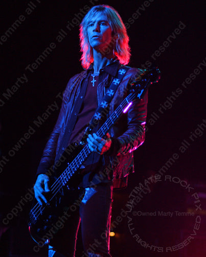Photo of bassist Duff McKagan of Velvet Revolver and Guns N' Roses in concert by Marty Temme