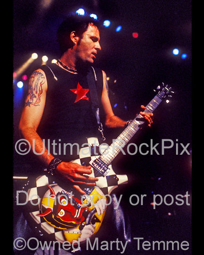 Photo of Erik Turner of Warrant in concert in 2003 by Marty Temme