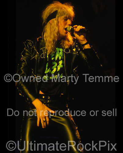 Photo of Jani Lane of Warrant performing in concert in 1989 by Marty Temme