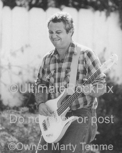 Photo of Mike Watt with his Danelectro bass during a photo shoot in San Pedro by Marty Temme