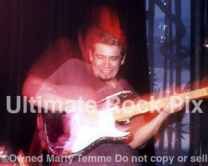 Photo of Joe Baiza performing with Mike Watt in concert in 1997 by Marty Temme