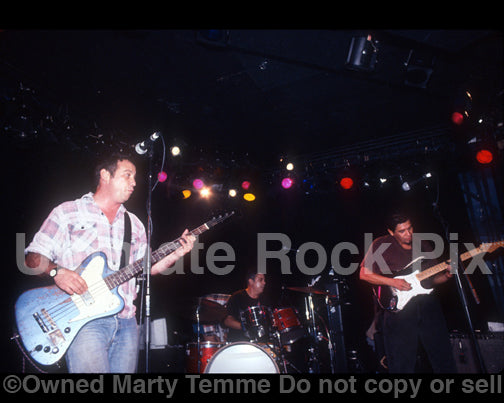 Photo of Mike Watt, Stephen Hodges and Joe Baiza in concert in 1997 by Marty Temme