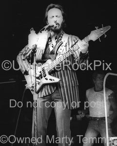 Photo of John Entwistle of The Who playing his Alembic bass in concert in 1980 by Marty Temme