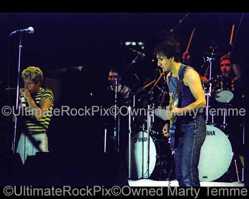 Photo of Pete Townshend, Roger Daltrey and Kenny Jones of The Who in concert in 1982 by Marty Temme