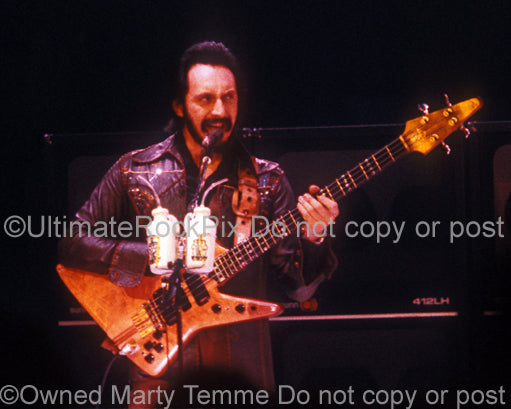 Photo of John Entwistle of The Who playing his Alembic bass in concert in 1979 by Marty Temme