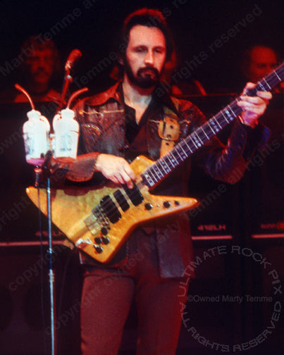 Photo of bass player John Entwistle of The Who in concert in 1979 by Marty Temme