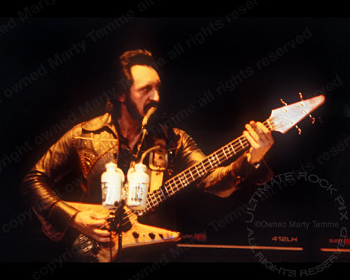 Photo of bassist John Entwistle of The Who playing his Alembic bass in 1979 by Marty Temme