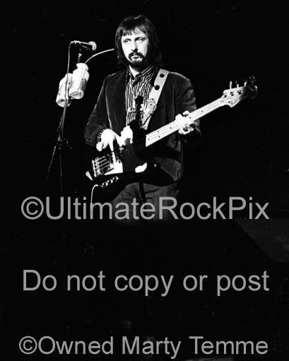 Photo of John Entwistle of The Who in concert in 1974 by Marty Temme