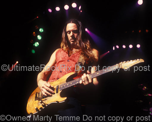 Photo of guitarist Reb Beach of Whitesnake in concert by Marty Temme