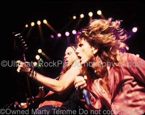 Photo of David Coverdale and Reb Beach of Whitesnake in concert by Marty Temme