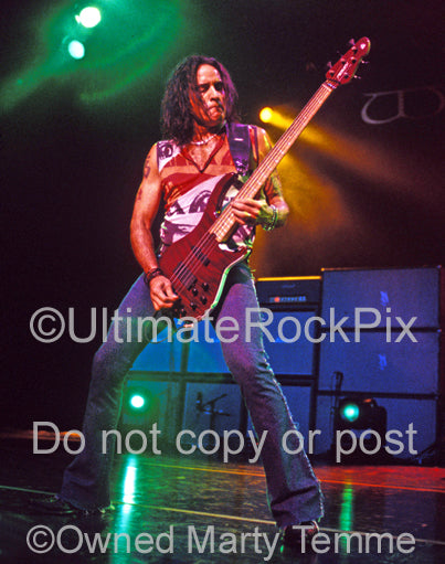 Photo of bassist Marco Mendoza of Whitesnake in concert by Marty Temme