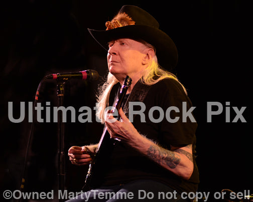 Photo of Johnny Winter in concert in 2013 by Marty Temme
