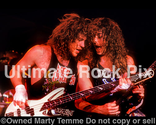Photo of Kip Winger and Reb Beach in concert in 1989 by Marty Temme