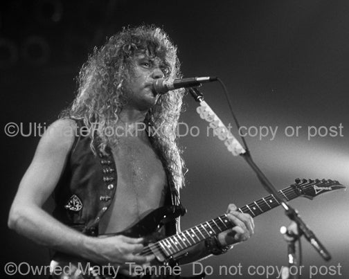 Black and white photo of Reb Beach of Winger in concert in 1989 by Marty Temme