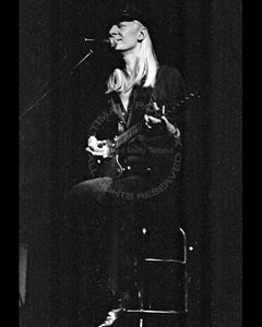Black and white photo of Johnny Winter in concert in 1979 by Marty Temme