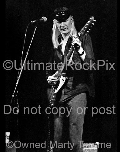 Black and white photos of Johnny Winter with his Gibson Firebird in concert in 1979 by Marty Temme