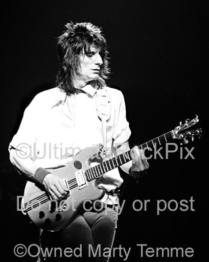 Black and white photo of Ron Wood of The Rolling Stones playing a Kramer guitar in concert in 1979 by Marty Temme