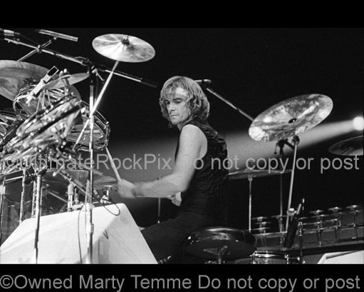 Photo of drummer Alan White of the band Yes in concert in 1978 by Marty Temme