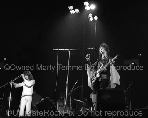 Black and white photo of Jon Anderson and Chris Squire of Yes in concert in the 1970's by Marty Temme